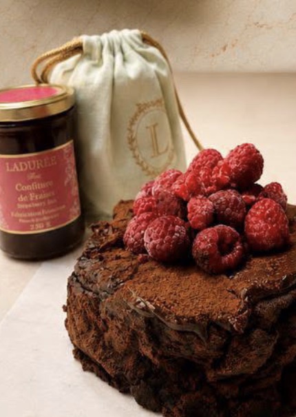 Flourless chocolate torté topped with fresh raspberries
